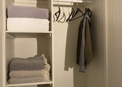 towels hanging in a closet