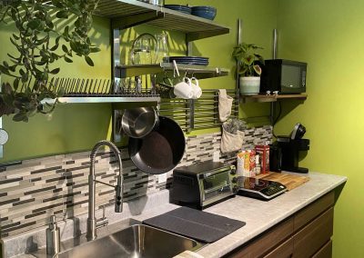 kitchenette with cookware, sink, microwave