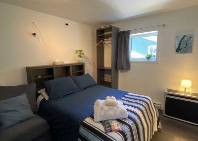 double-sized bed with blue beddings